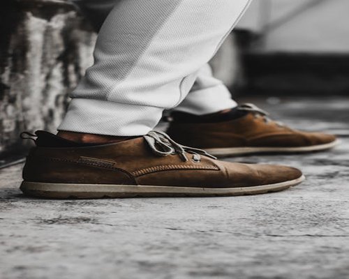 Close-up of comfortable ergonomic walking shoes on urban pavement